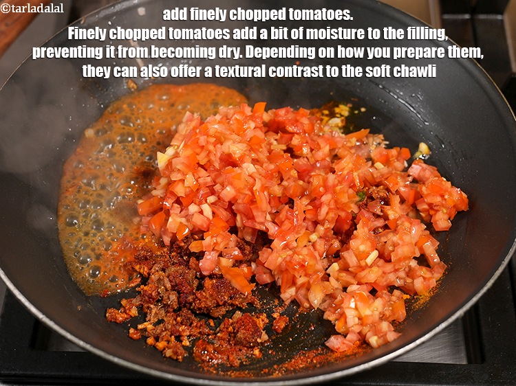 Step 26 – Add 1&frac12; cups finely <a href="https://www.tarladalal.com/glossary-chopped-tomatoes-779i">chopped tomatoes</a>. Finely chopped tomatoes add a bit of moisture …