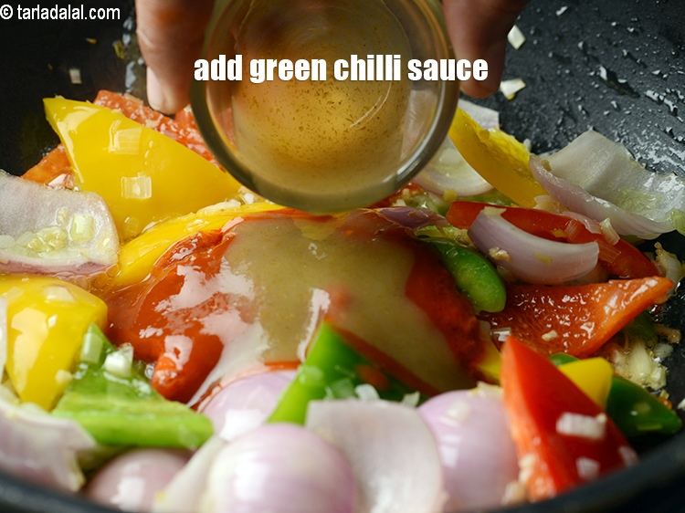 Step 27 – Add 1 tsp <a href="https://www.tarladalal.com/glossary-green-chilli-sauce-hara-chilli-sauce-1208i">green chilli sauce</a>.