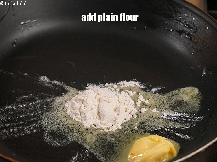 Step 27 – Add 1 tbsp <a href="https://www.tarladalal.com/glossary-plain-flour-maida-188i">plain flour (maida)</a>.