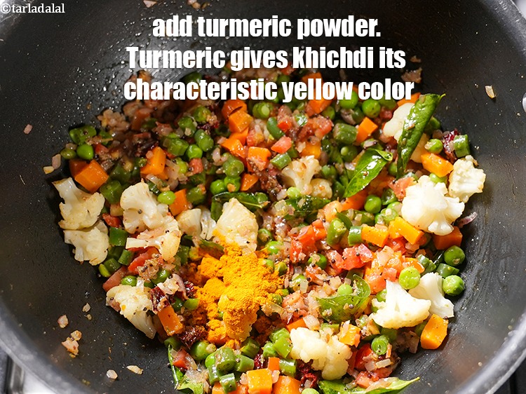 Step 26 – Add &frac12; tsp&nbsp;<a href="https://www.tarladalal.com/glossary-turmeric-powder-haldi-645i">turmeric powder (haldi)</a>. Turmeric gives khichdi its characteristic yellow color.