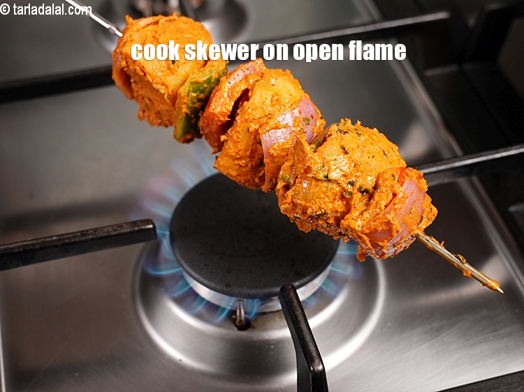 Step 27 – Cook the skewer on an open flame for 3 to 4 minutes.
