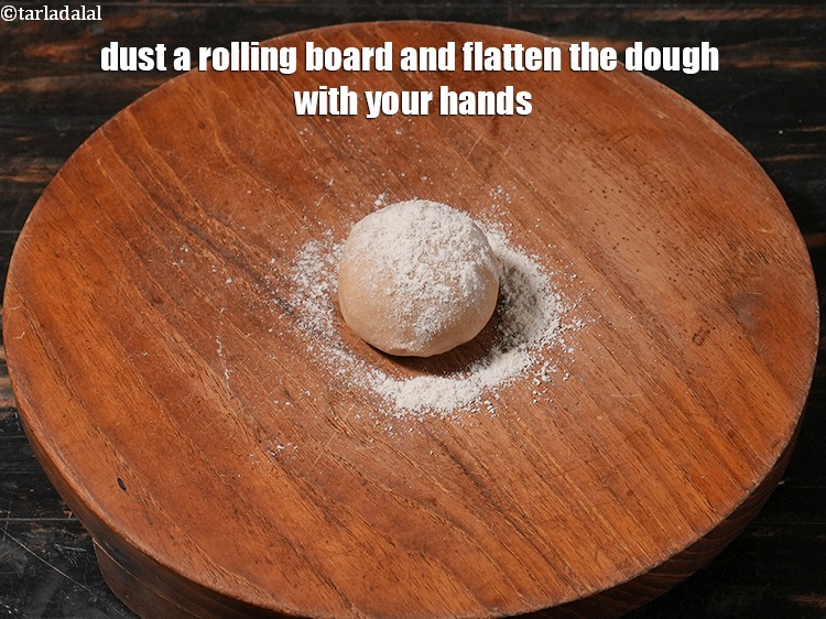 Step 34 – Dust a rolling board and flatten the dough with your hands.