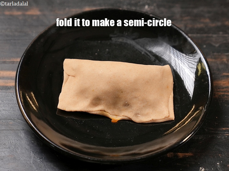 Step 26 – Fold it to make a semi-circle.