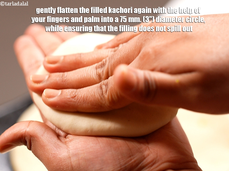 Step 26 – Gently flatten the filled kachori again with the help of your fingers and palm into …