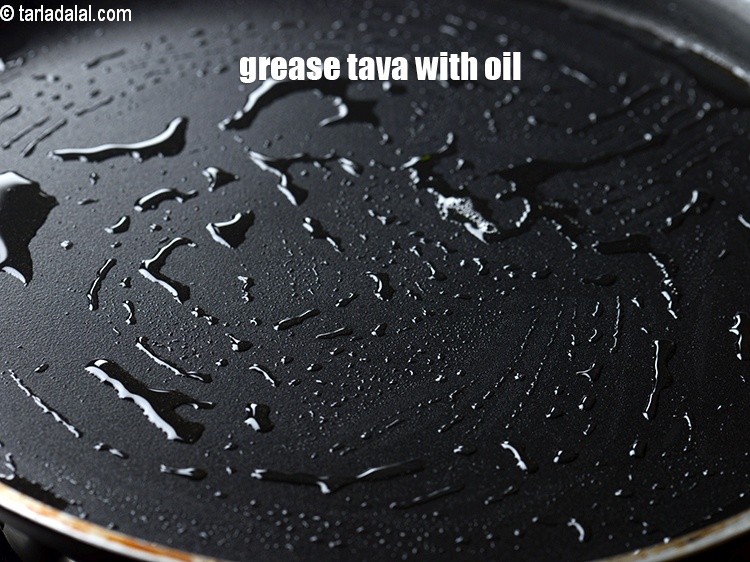 Step 27 – Grease a tava with &frac14; tsp of oil.