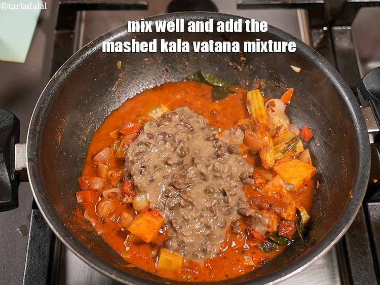 Step 26 – Mix well. Add the mashed kala vatana mixture.