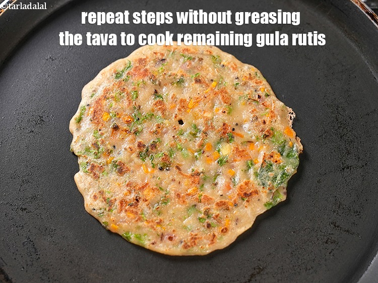 Step 27 – Repeat steps without greasing the tava to cook remaining 7 gula ruti.