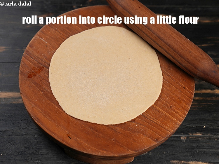 Step 28 – Roll a portion into a 150 mm. (6&rdquo;) diameter circle using a little whole wheat …