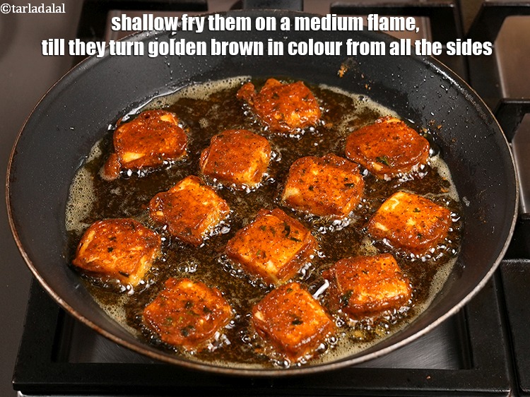 Step 26 – Shallow fry them on a medium flame, till they turn golden brown in colour from …