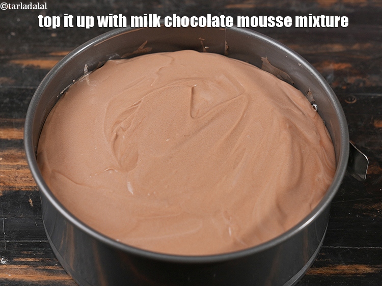Step 26 – Top it up with milk chocolate mousse mixture.