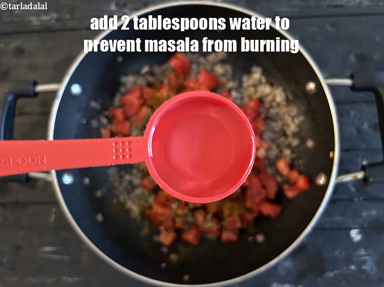 Step 32 – Add <strong>2 tablespoons of water </strong>to prevent the masala from burning.