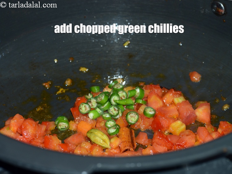 Step 27 – Add 2 tsp <a href="https://www.tarladalal.com/glossary-chopped-green-chilli-820i">chopped green chillies</a>.