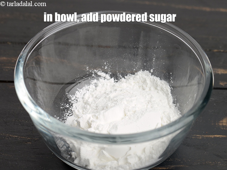 Step 28 – In a small bowl, add &frac14; cup <a href="https://www.tarladalal.com/glossary-powdered-sugar-280i">powdered sugar</a>.