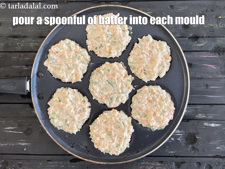 Step 26 – <meta charset="UTF-8" /> Pour a spoonful of the batter in each uttapa mould to make …