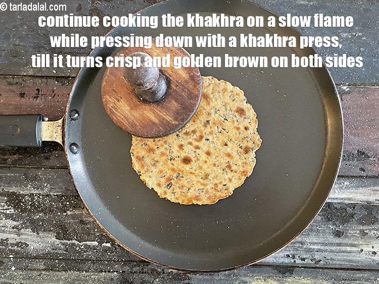 Step 27 – <meta charset="UTF-8" />Continue cooking the&nbsp;<strong>khakhra</strong>&nbsp;on a slow flame, while pressing with a&nbsp;<strong>khakhra</strong>&nbsp;press or a folded …