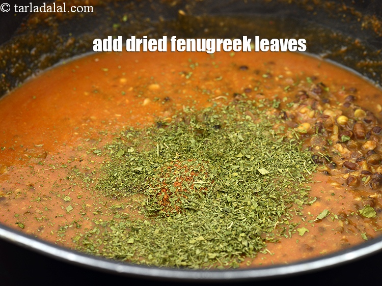 Step 26 – Add 1 tbsp <a href="https://www.tarladalal.com/glossary-dried-fenugreek-leaves-kasuri-methi-374i">dried fenugreek leaves (kasuri methi)</a>. Crush the kasuri methi slightly.