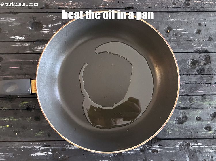 Step 27 – <meta charset="UTF-8" />To make&nbsp;basic malvani gravy, heat 2 tablespoons oil&nbsp;in a kadhai.