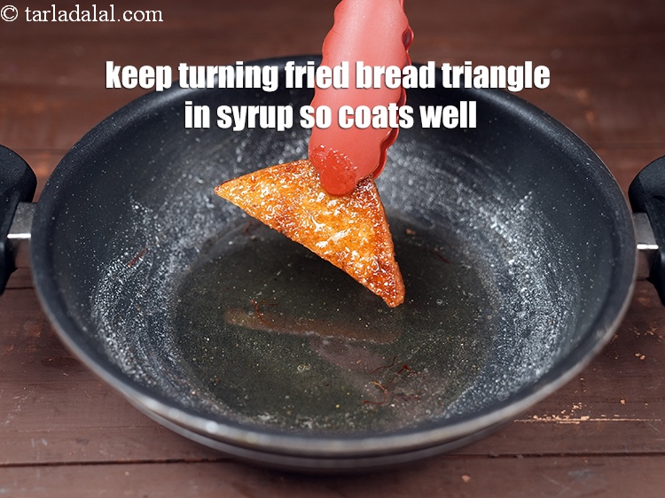 Step 27 – Keep turning the fried bread triangle in the syrup so that the syrup coats the …