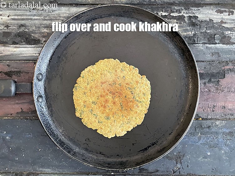 Step 28 – <meta charset="UTF-8" /> Flip and cook the&nbsp;<strong>Khakhra</strong>&nbsp;on the other side. Cook on slow flame to …