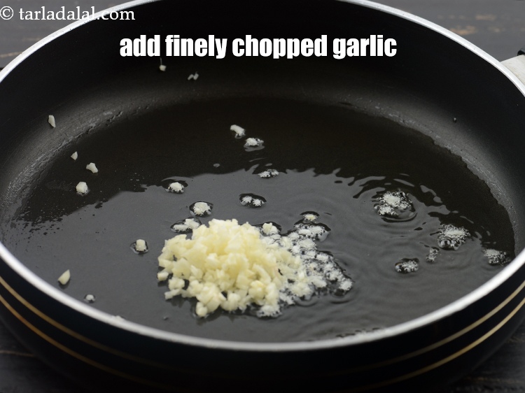 Step 27 – Add 2 tsp&nbsp;finely&nbsp;<a href="https://www.tarladalal.com/glossary-chopped-garlic-790i">chopped garlic (lehsun)</a>.