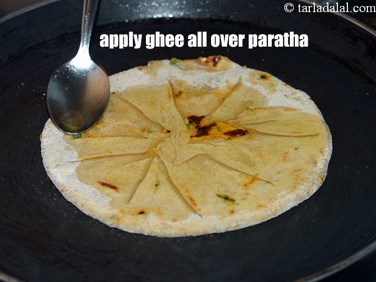 Step 27 – Apply 1 tsp of ghee all over the paratha.