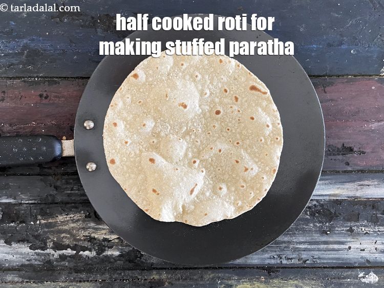 Step 19 – Flip over and cook the other side the same way. Your half cooked roti is …