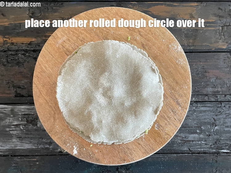 Step 27 – Place the other dough circle over it.