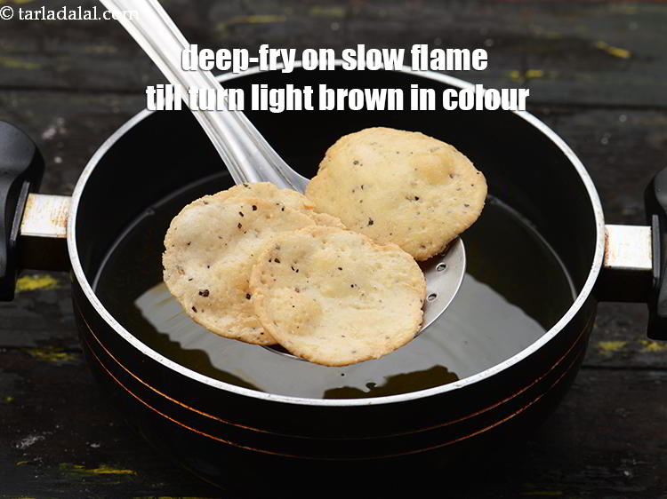 Step 28 – Deep-fry them on a slow flame till they turn light brown in colour from both …