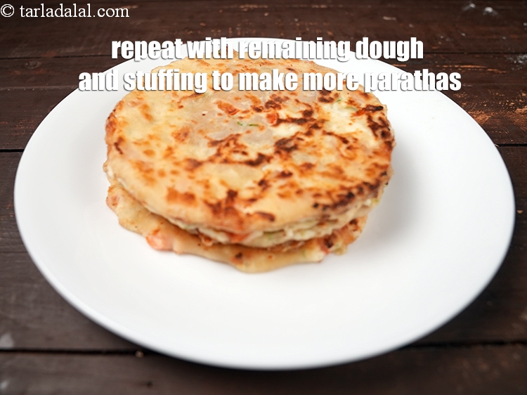 Step 27 – Repeat with the remaining dough and stuffing to make 7 more parathas.