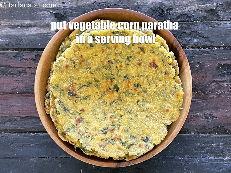 Step 26 – Put <strong>vegetable corn paratha</strong> in a serving bowl.