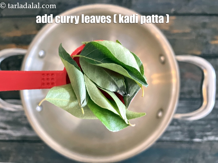 Step 26 – Add&nbsp;<meta charset="UTF-8" />8&nbsp;<a href="glossary-curry-leaves-kadi-patta-kadipatta-388i">curry leaves (kadi patta)</a>.