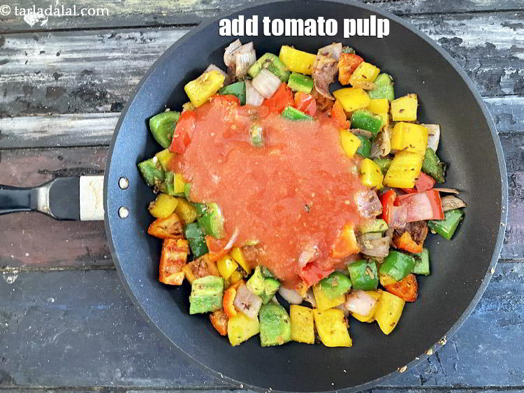 Step 26 – Add&nbsp;1 cup&nbsp;fresh&nbsp;<a href="glossary-tomato-pulp-tamatar-ka-pulp-1039i">tomato pulp</a>.