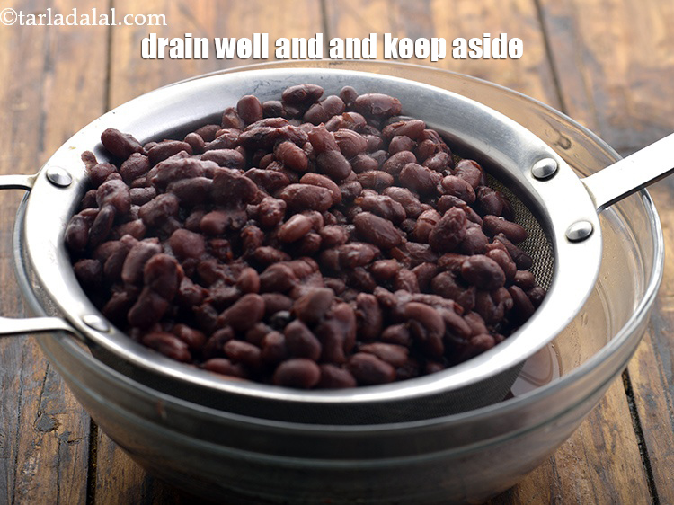 Step 10 – Strain the rajma and keep aside. You may reserve and use this water while preparing …