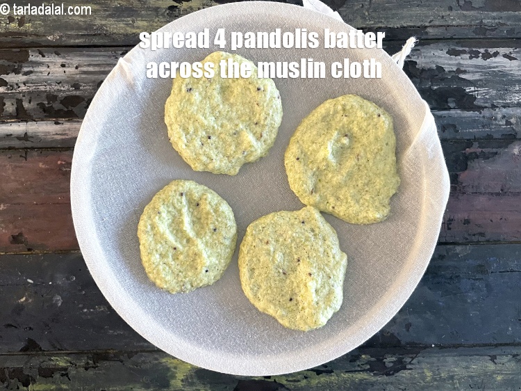 Step 41 – Spread 4 pandoli (like idlis) over the muslin cloth.