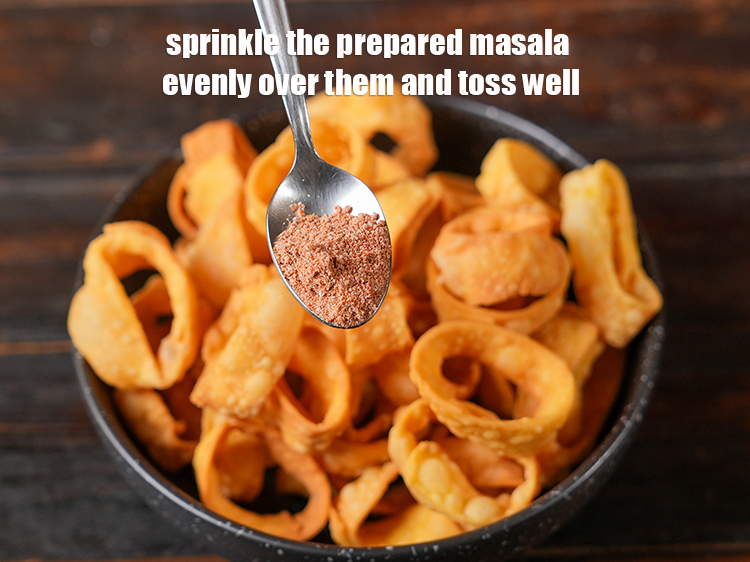 Step 26 – Sprinkle the prepared masala evenly over them and toss well.