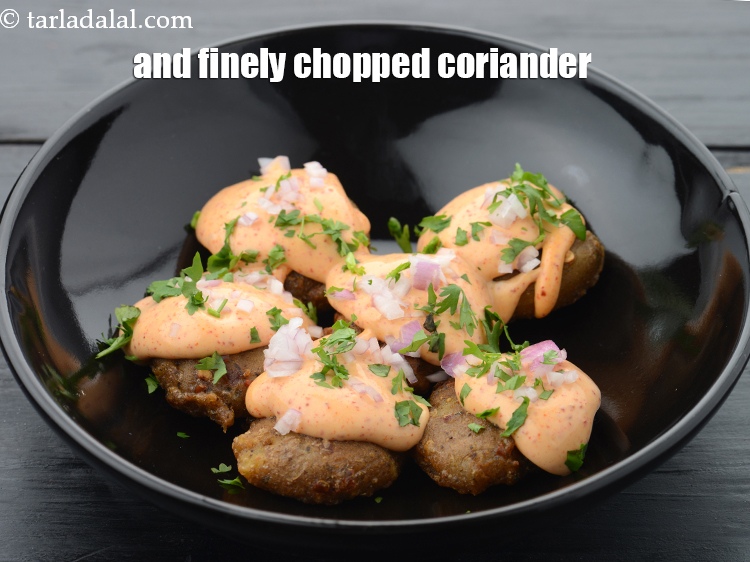 Step 26 – And 1 tsp&nbsp;finely&nbsp;<a href="https://www.tarladalal.com/glossary-chopped-coriander-783i">chopped coriander (dhania)</a>.&nbsp;