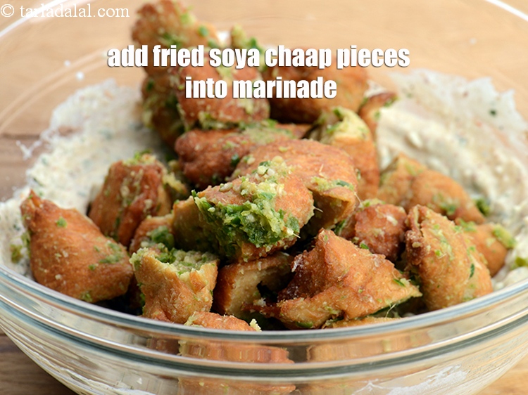 Step 29 – Add the fried soya chaap pieces into the marinade.