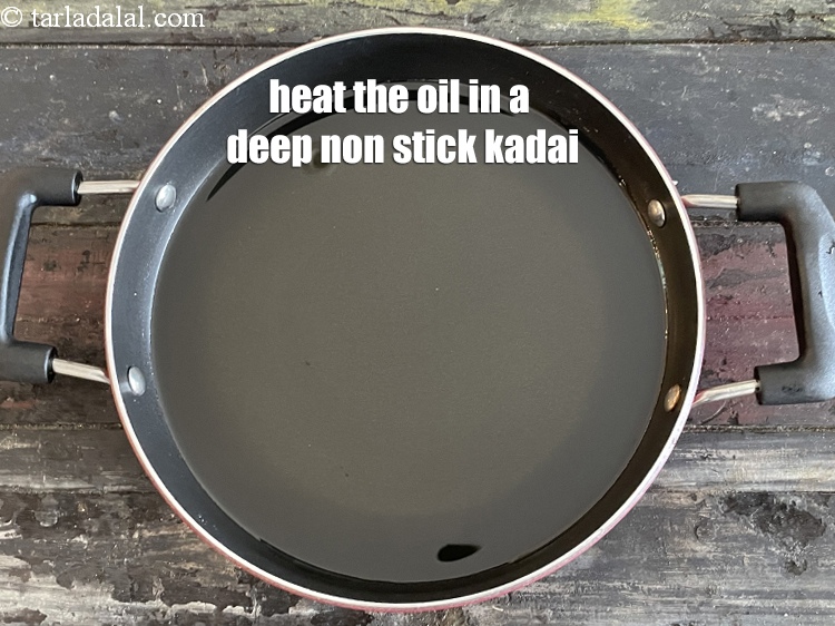 Step 40 – <meta charset="UTF-8" />Heat the oil in a deep non-stick kadhai.