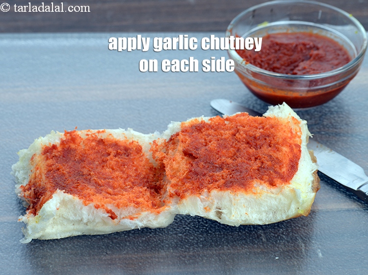 Step 28 – Apply &frac12; tsp <a href="https://www.tarladalal.com/garlic-chutney-2865r">garlic chutney</a> on each side and spread.&nbsp;