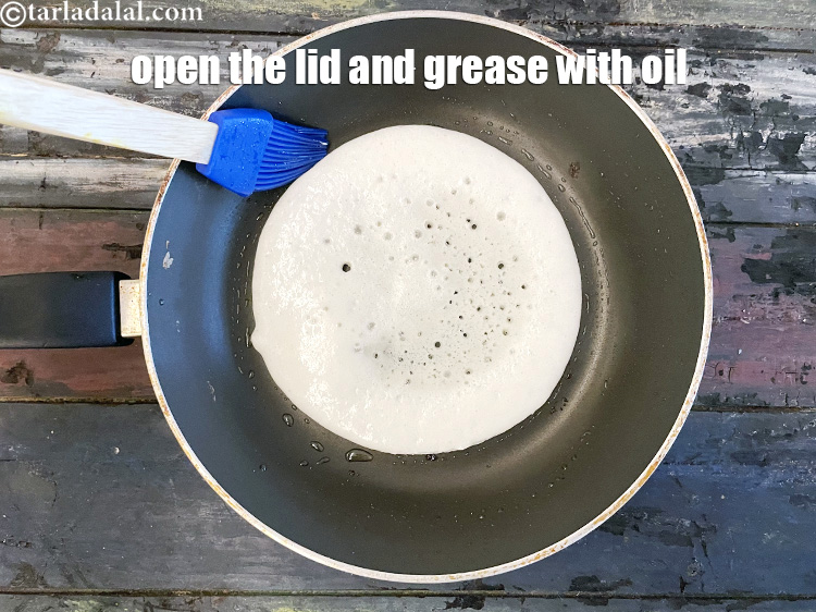 Step 33 – <meta charset="UTF-8" /> Open the lid and spread &frac12; tsp of oil along the edges.