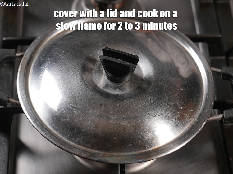 Step 32 – Cover with a lid and cook on a slow flame for 2 to 3 minutes.