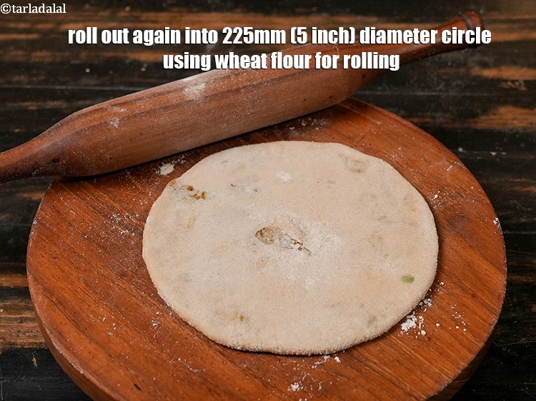 Step 26 – Roll out again into 225mm (5 inch) diameter circle using wheat flour for rolling.
