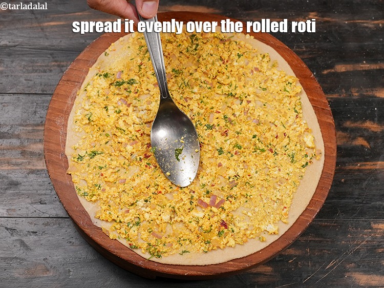Step 27 – Spread it evenly over the rolled roti.