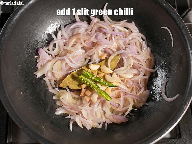 Step 28 – Add 1 <a href="https://www.tarladalal.com/glossary-slit-green-chillies-1856i">slit green chilli</a>.