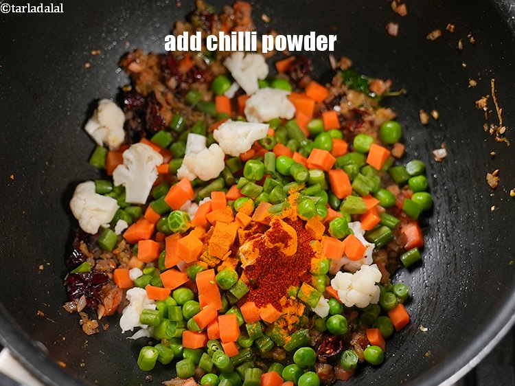 Step 27 – Add &frac12; tsp <a href="https://www.tarladalal.com/glossary-chilli-powder-red-chilli-powder-339i">chilli powder</a>.&nbsp;