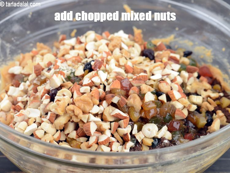 Step 27 – Add &frac34; cup <a href="https://www.tarladalal.com/glossary-chopped-mixed-nuts-928i">chopped mixed nuts</a>.