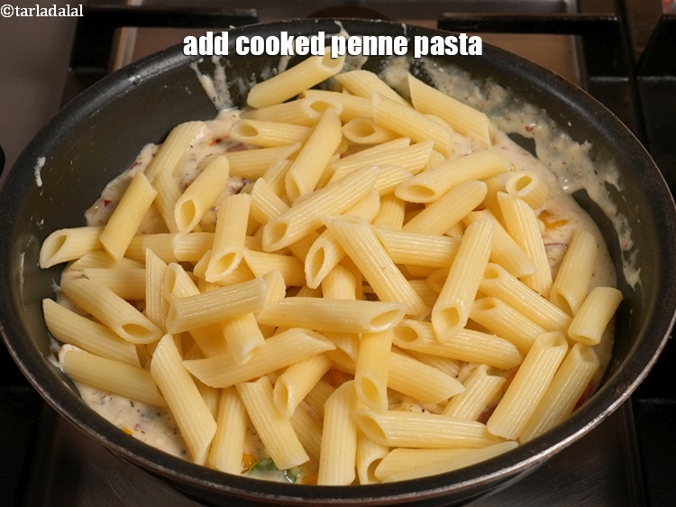 Step 27 – Add 3 cups <a href="https://www.tarladalal.com/glossary-cooked-penne-1892i">cooked penne</a>&nbsp;<a href="https://www.tarladalal.com/glossary-pasta-570i">pasta</a>.