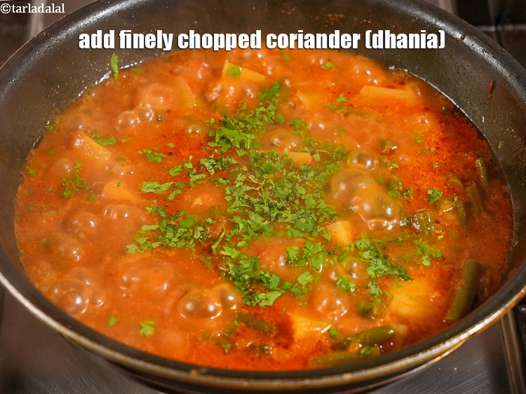 Step 27 – Add&nbsp;1 tbsp&nbsp;finely&nbsp;<a href="https://www.tarladalal.com/glossary-chopped-coriander-783i">chopped coriander (dhania)</a>.