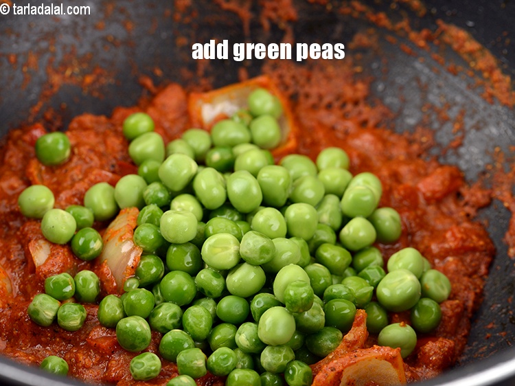 Step 28 – Add &frac12; cup <a href="https://www.tarladalal.com/glossary-green-peas-matar-hare-matar-vatana-180i">green peas</a>.