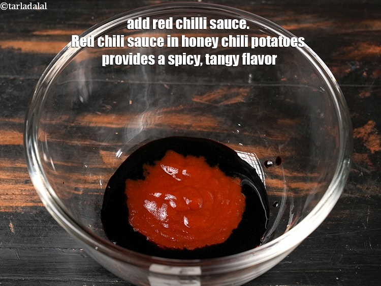 Step 26 – Add 1 tbsp <a href="https://www.tarladalal.com/glossary-red-chilli-sauce-lal-chilli-sauce-810i">red chilli sauce</a>. Red chili sauce in honey chili potatoes provides …